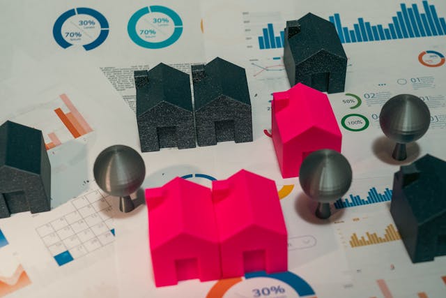 colorful model houses on financial charts