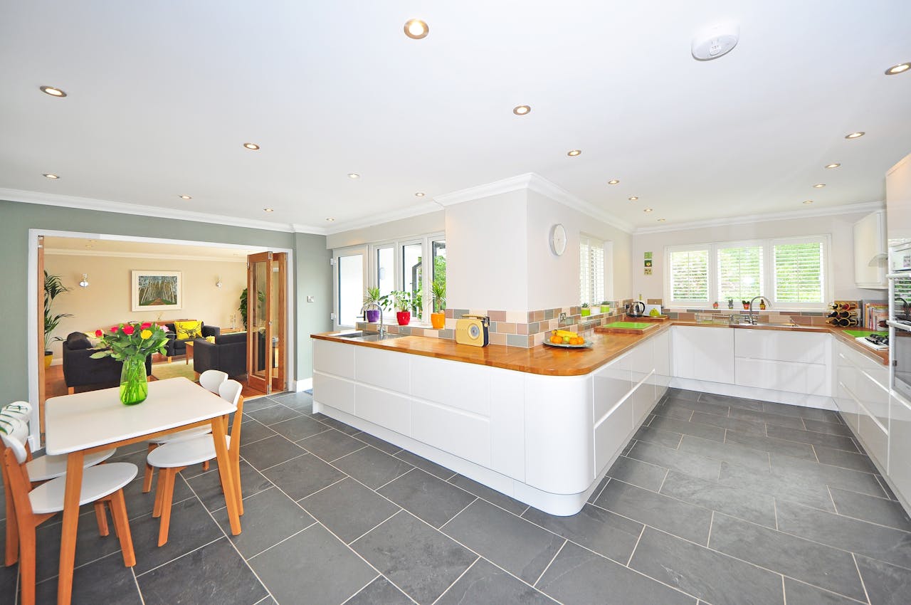 grey floors and white island kitchen
