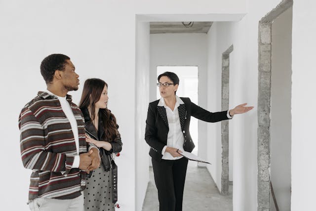 person showing two people house